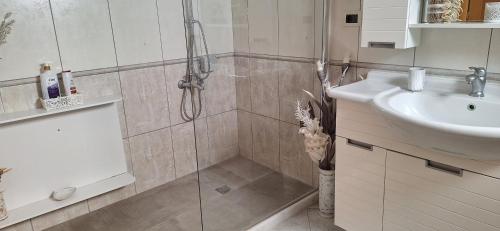a bathroom with a shower and a sink at Modern Villa in Chania in Perivólia
