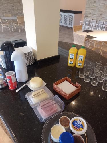 a counter top with some food and drinks on it at Paraíso do sul - Shangrilá in Pontal do Paraná
