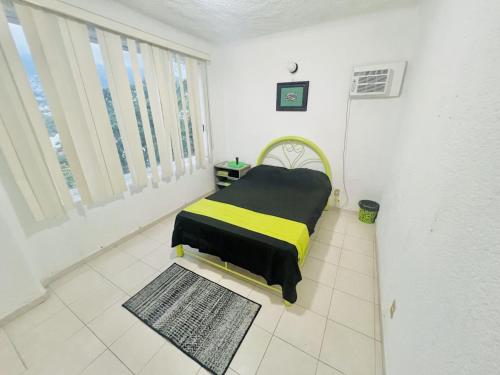 Postel nebo postele na pokoji v ubytování Habitaciones GLV