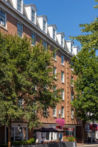 a large brick building with trees in front of it at The Georgetown Inn in Washington, D.C.