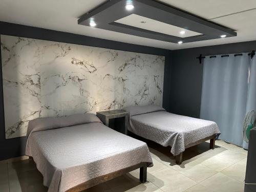 Postel nebo postele na pokoji v ubytování HOTEL CALZADa