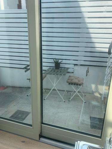 a view of a patio through a glass door at Village 3 bed Town House in Dublin