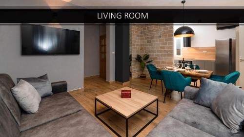 un salon avec un canapé et une table dans l'établissement APARTMENTS4YOU SUPETAR 5 - brand NEW luxury 2-BR - 200 meters from the beach - free parking - beautiful terrace, à Supetar