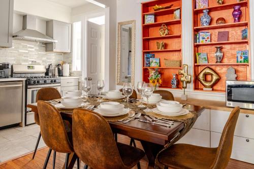 a kitchen with a wooden table with chairs around it at Elegant 4BR & 4BA House in DC in Washington, D.C.