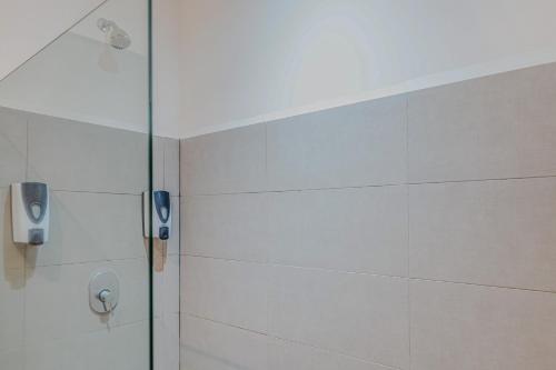 a shower stall with a phone on the wall at Puerto Azul 155 in El Roble