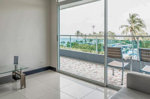 a living room with a view of the ocean at Puerto Azul 153 in El Roble
