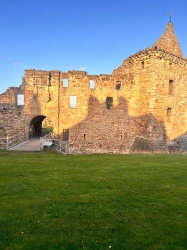 a large brick building with a tunnel in it at Lodge 17 St Andrews in St. Andrews