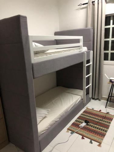 Una cama o camas en una habitación de Legacy Hostel