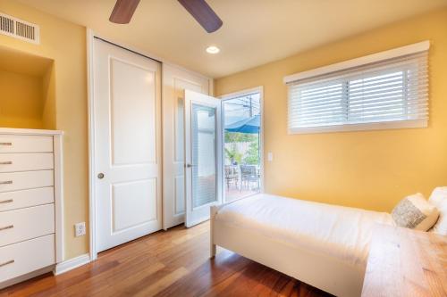 a bedroom with a bed and a window at Sand Patch in San Diego