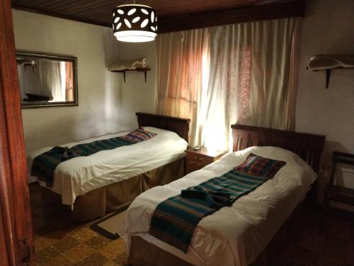 Una cama o camas en una habitación de Hotel Casa Chapultepec