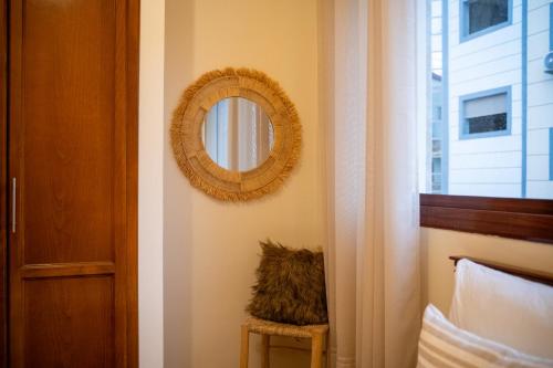a mirror on a wall next to a window at TangierApp in Tangier