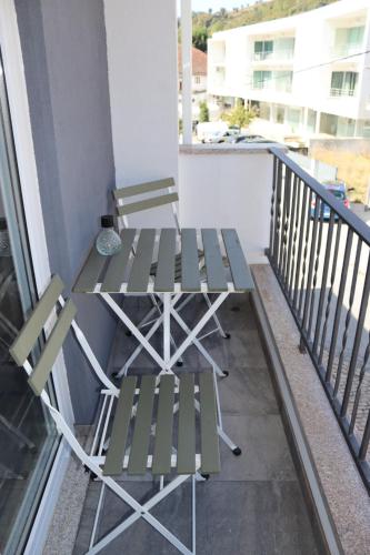 a pair of chairs sitting on a balcony at Villa Cerva Home in Cerva