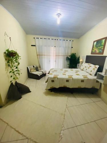 Кровать или кровати в номере CASA DE VERANEIO EM ILHÉUS