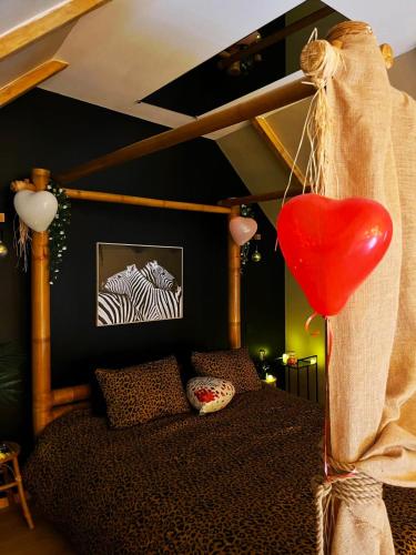 Ένα ή περισσότερα κρεβάτια σε δωμάτιο στο Appartement SPA Safari
