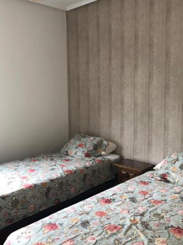 Ένα ή περισσότερα κρεβάτια σε δωμάτιο στο Libarona Goya