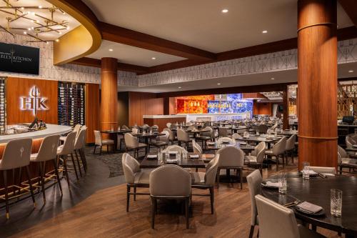 a restaurant with tables and chairs and a bar at Caesars Republic Lake Tahoe in Stateline