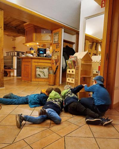 a group of people laying on the floor in a kitchen at Gasthof Mayd in Erlangen