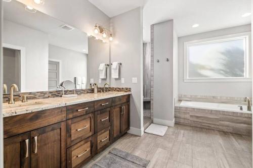 a large bathroom with two sinks and a tub at Boise Hills Oasis in Boise