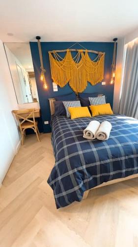 a bedroom with a bed with two towels on it at Nautical living in Manly in Sydney