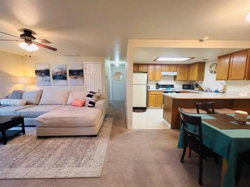 a living room with a couch and a kitchen at Sugar Shack in Downtown Meridian in Meridian