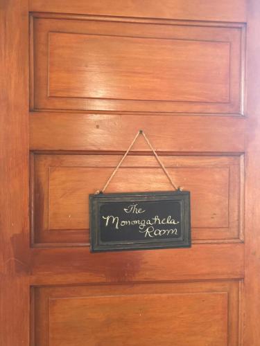a wooden door with a sign on it at ENTIRE Pittsburgh Home Close To Events - Kid Friendly - Designated Dog & Cat Areas - Private Patio - Free Parking - Fireplace in Pittsburgh