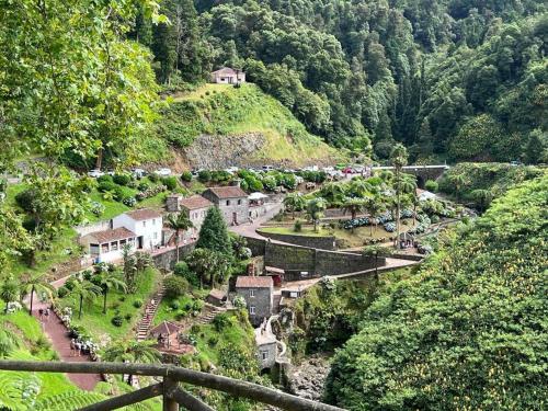 a village on top of a hill with trees at Miramar in Ribeira Grande