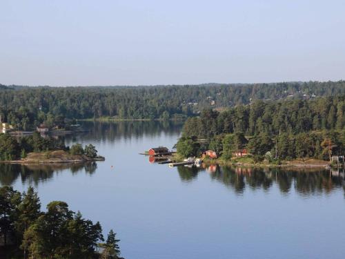 an island in the middle of a large lake at 6 person holiday home in LÖNASHULT in Lönashult