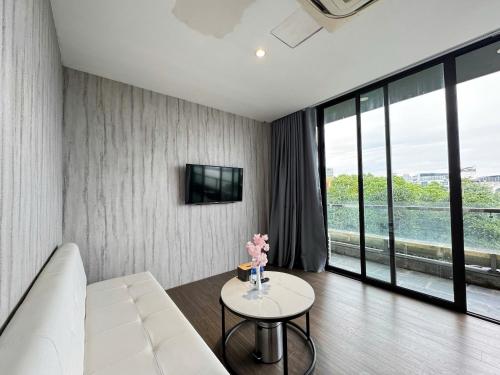 a living room with a white couch and a table at 22Land Moon West Lake in Hanoi