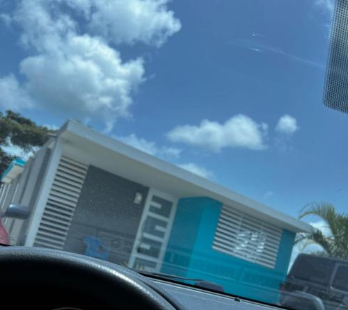 a house with a car in front of it at relax house in San Lorenzo