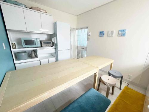 Kuchyň nebo kuchyňský kout v ubytování KOKOYUI GUESTHOUSE Taiji