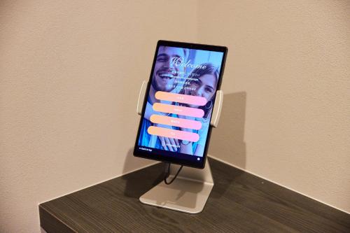 a tablet computer is plugged into a wall at Hub-Fun in Katsuno