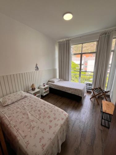 Ένα ή περισσότερα κρεβάτια σε δωμάτιο στο Apartamento Sandy-Zona Sul