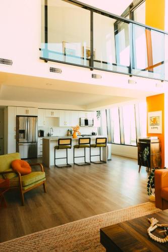 a large room with a kitchen and a living room at NEW Pause Penthouse Lofts -Downtown- Free Parking in Halifax
