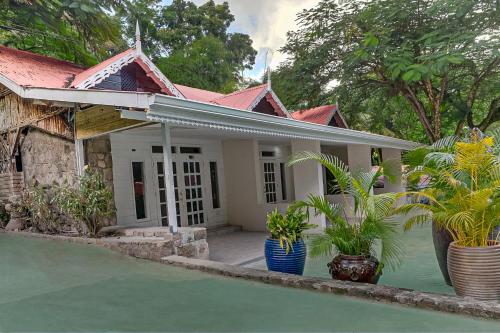 a house with plants in front of it at Fond Doux Eco Resort in Soufrière