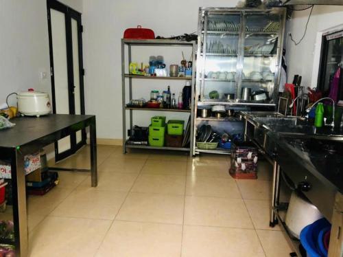 a kitchen with a sink and a counter top at ST Homestay Tản Lĩnh - Venuestay in Mỹ Khê