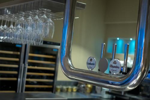 a bunch of cups and spoons in a mirror at The Grand at Grasmere in Grasmere