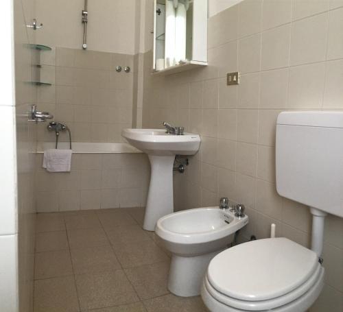 a bathroom with a toilet and a sink at Villa Pozzi in Sestri Levante