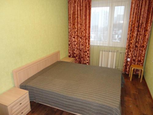 Кровать или кровати в номере Borisovskie Prudy Apartment