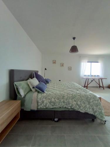 Ένα ή περισσότερα κρεβάτια σε δωμάτιο στο LA SIESTA Suites