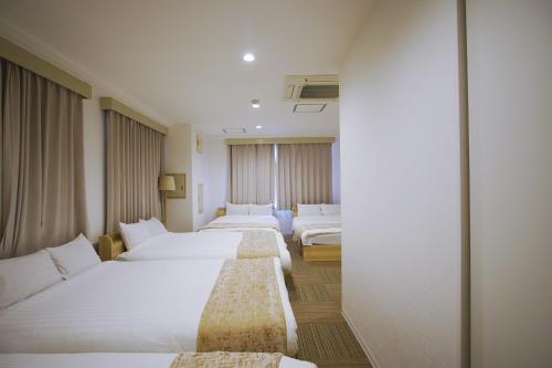 Ένα ή περισσότερα κρεβάτια σε δωμάτιο στο INOVE VILLA Osaka