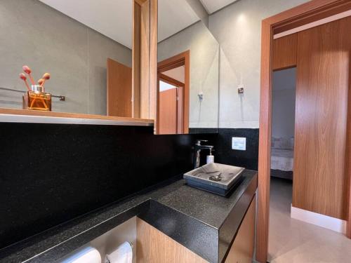 a kitchen with a sink and a counter top at Apto lindo nas montanhas! in Venda Nova do Imigrante