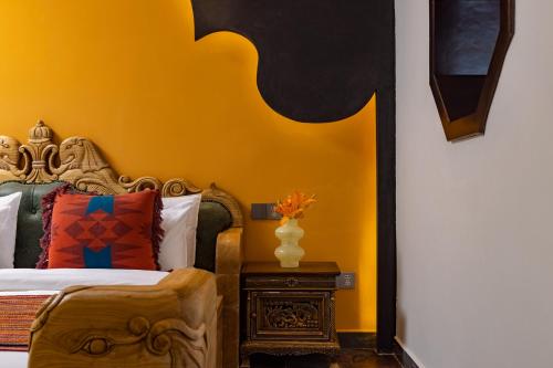 Ένα ή περισσότερα κρεβάτια σε δωμάτιο στο Lijiang Joland Guest House
