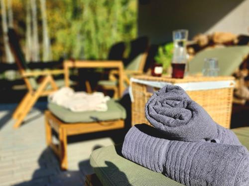 a persons foot in a sock sitting on a couch at Chata Leśna Polana in Kurzętnik