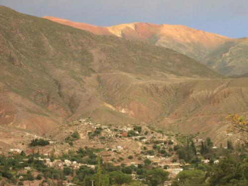 a small town in a valley in the mountains at La Calabaza Cabaña in Tilcara