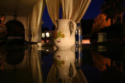 a white vase sitting on top of a table at Carmelina in Marina di Pescoluse