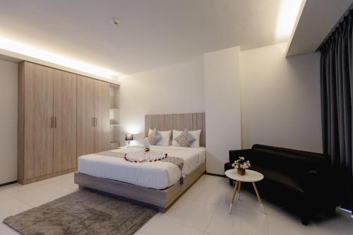 Ένα ή περισσότερα κρεβάτια σε δωμάτιο στο SUBANAN Residence Hatyai - ทรัพย์อนันต์ เรสซิเด้นซ์ หาดใหญ่