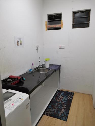 Kuchyň nebo kuchyňský kout v ubytování Sunny Point Hostel