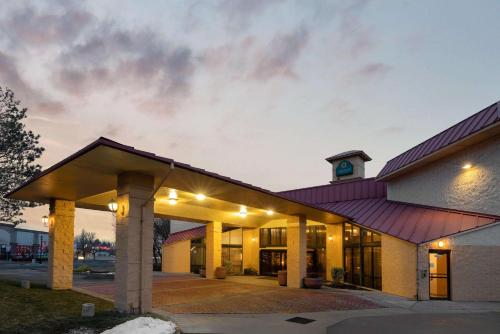 a building with a purple roof with a clock tower at La Quinta by Wyndham Salt Lake City - Layton in Layton