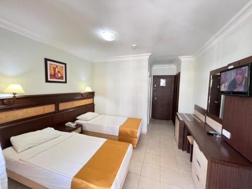 Katil atau katil-katil dalam bilik di Kleopatra Ada Hotel