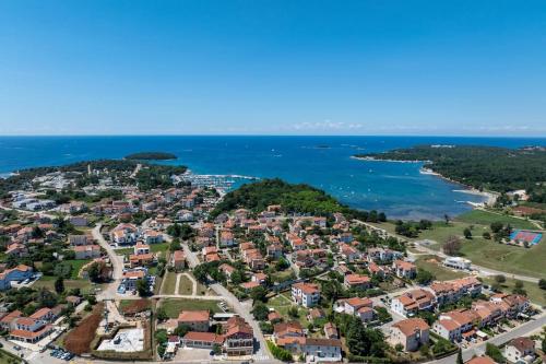 an aerial view of a residential suburb next to the ocean at Casa Cocooon in Funtana